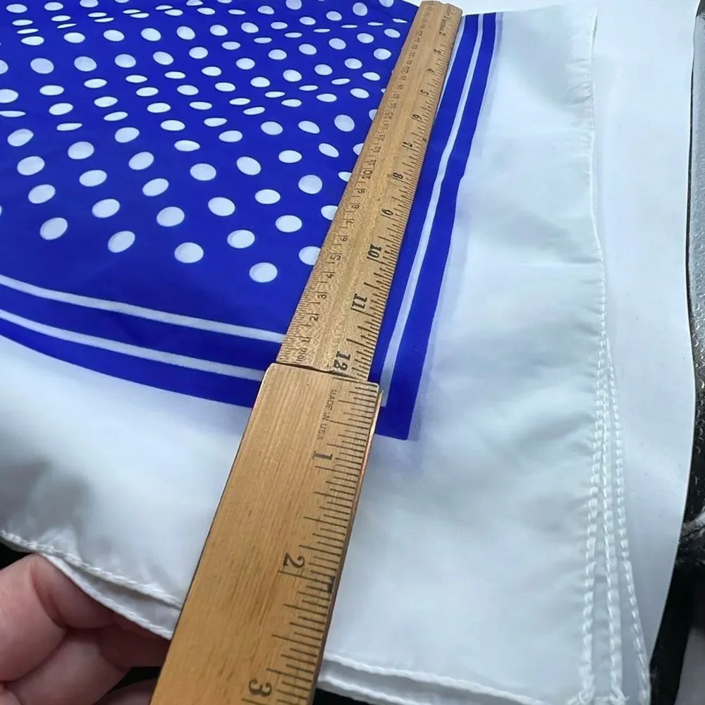 Vintage 26” X27” nylon hand rolled scarf. Water resistant.